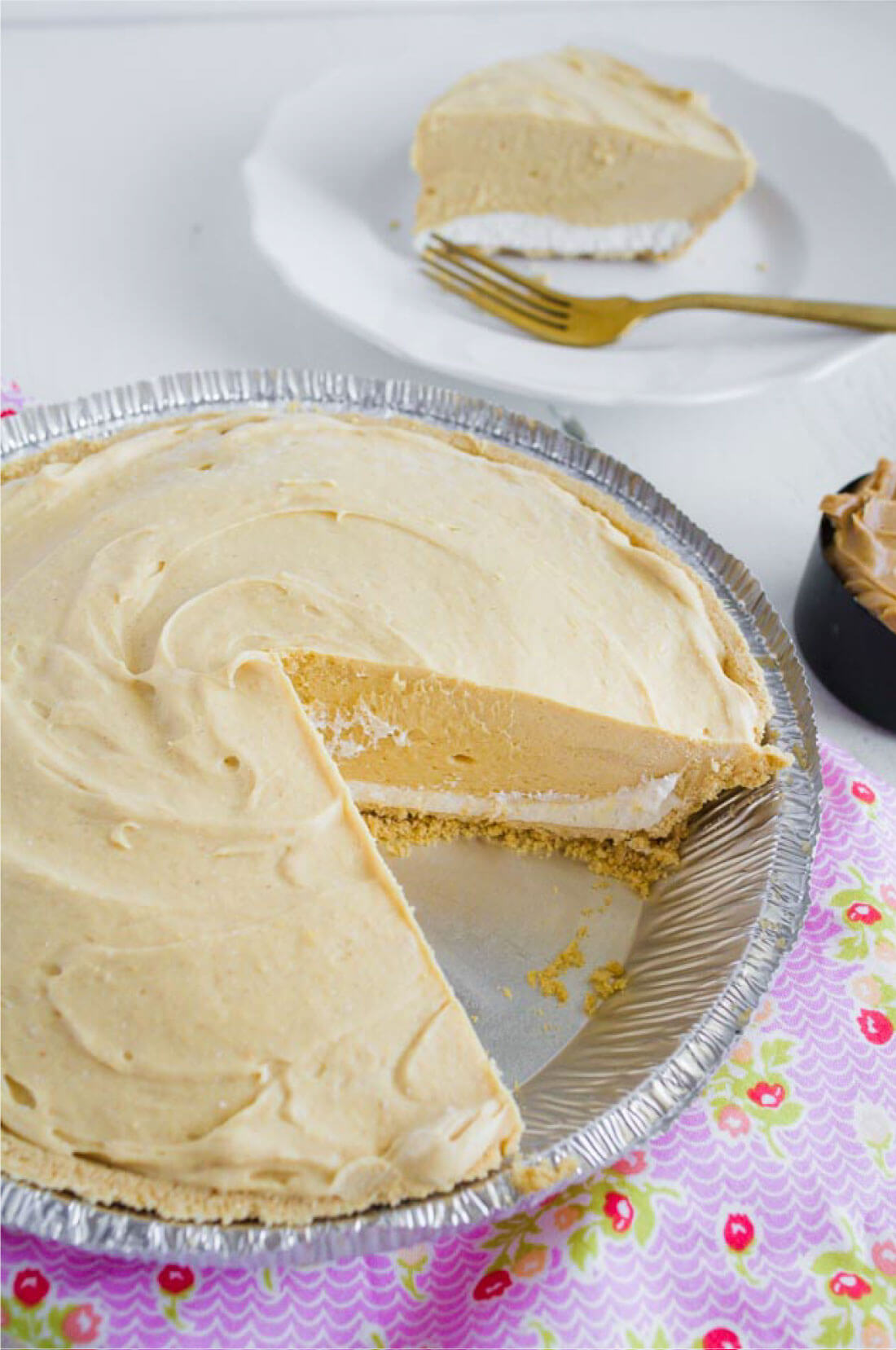 Frozen Peanut Butter Pie - this is a tasty treat for summer! A piece cut out of the pie.