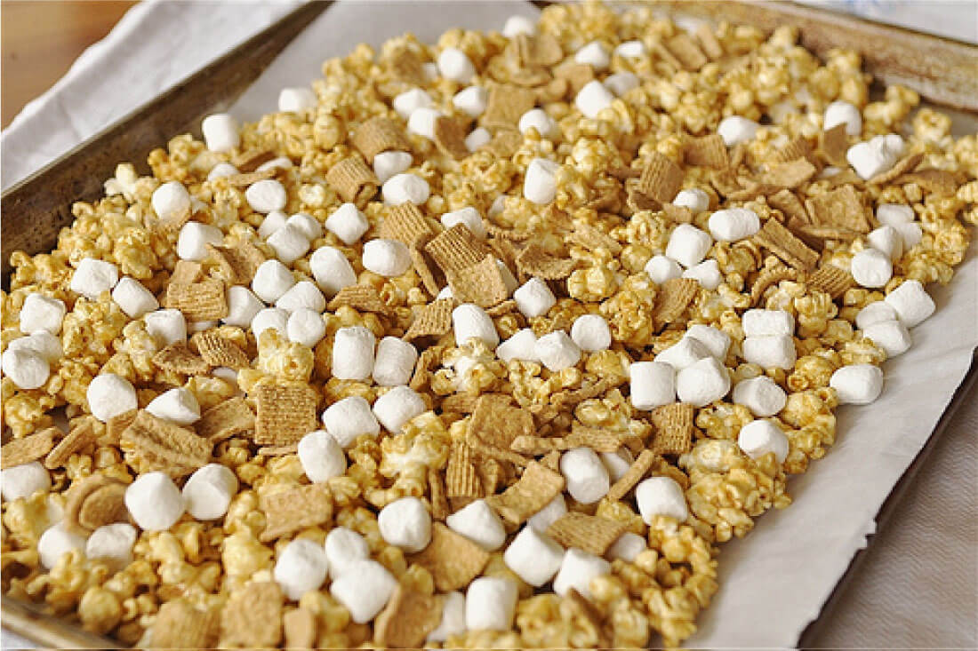 Take traditional Caramel Popcorn to the next level with this S'mores version! Step 1