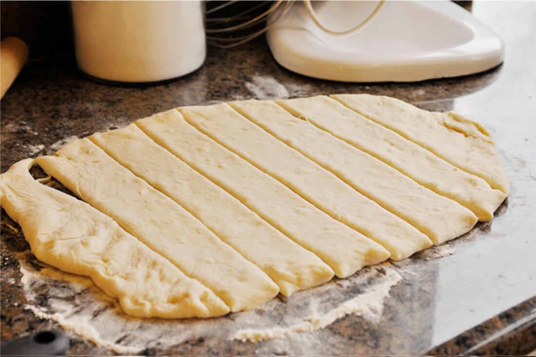 Cinnamon Sugar Breadsticks with Cream Cheese Frosting -step 3, cut into strips