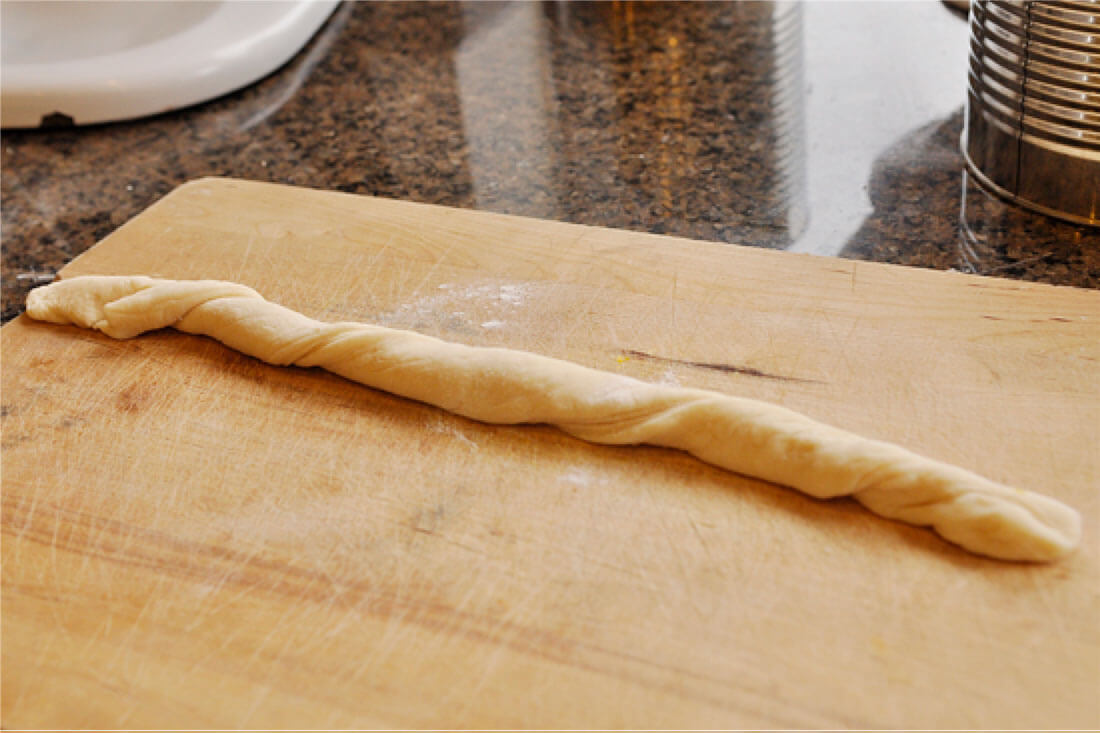 Cinnamon Sugar Breadsticks with Cream Cheese Frosting -step 4, roll into a snake