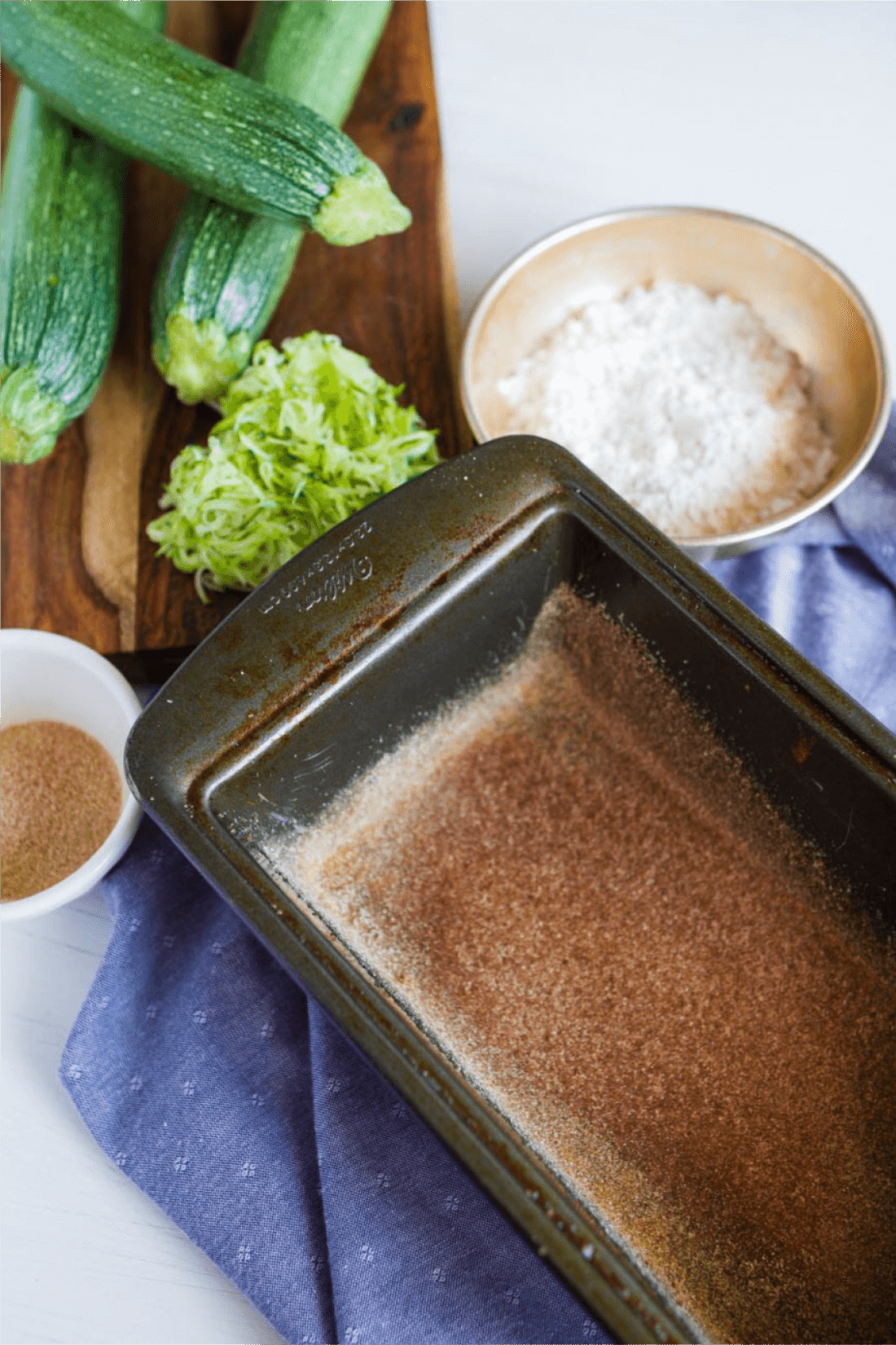 Zucchini Bread with Brown Sugar Topping - try this amazing quick bread. It's so easy to make and delicious! Add some cinnamon sugar to the loaf pan.