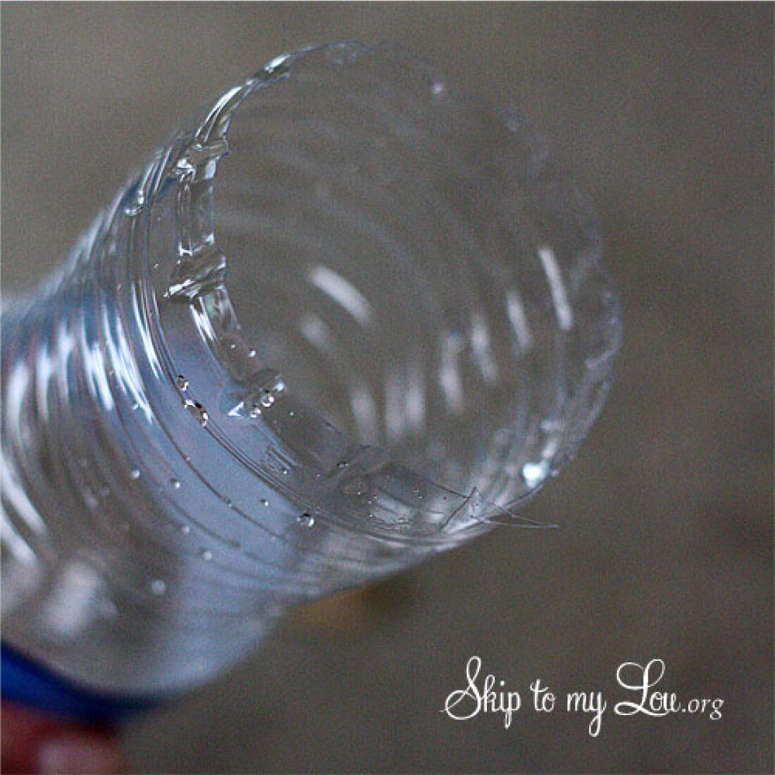 DIY Bubble Blower - Cut the bottom off of the empty water bottle.