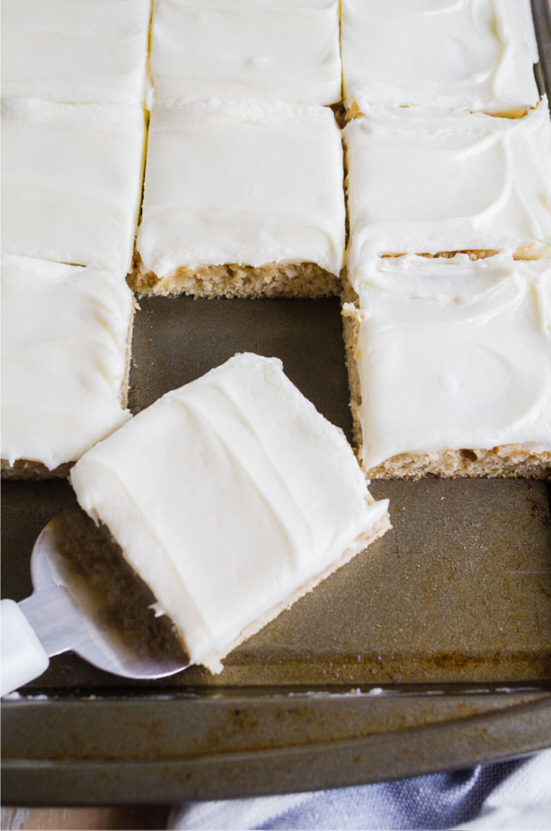 Frosted Banana Bars Recipe - use overripe bananas to make this recipe with cream cheese frosting. Serving a square.