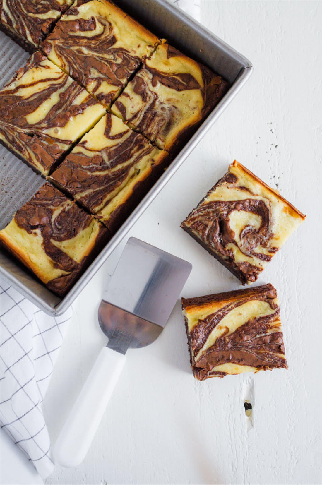 Cheesecake Brownies - they are delicious and simple and a fun take on regular brownies. Pan full of brownies. 