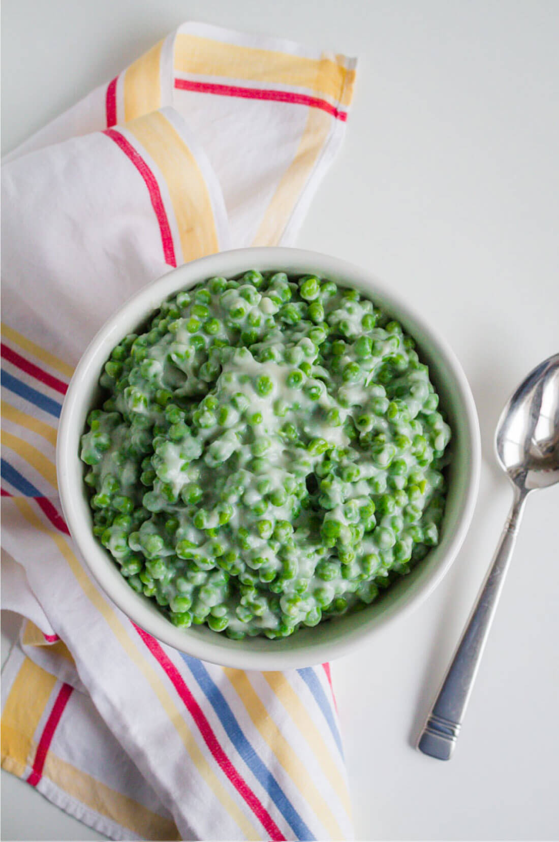 A delicious side dish, these Creamed Peas are yummy and easy to make. With a spoon.