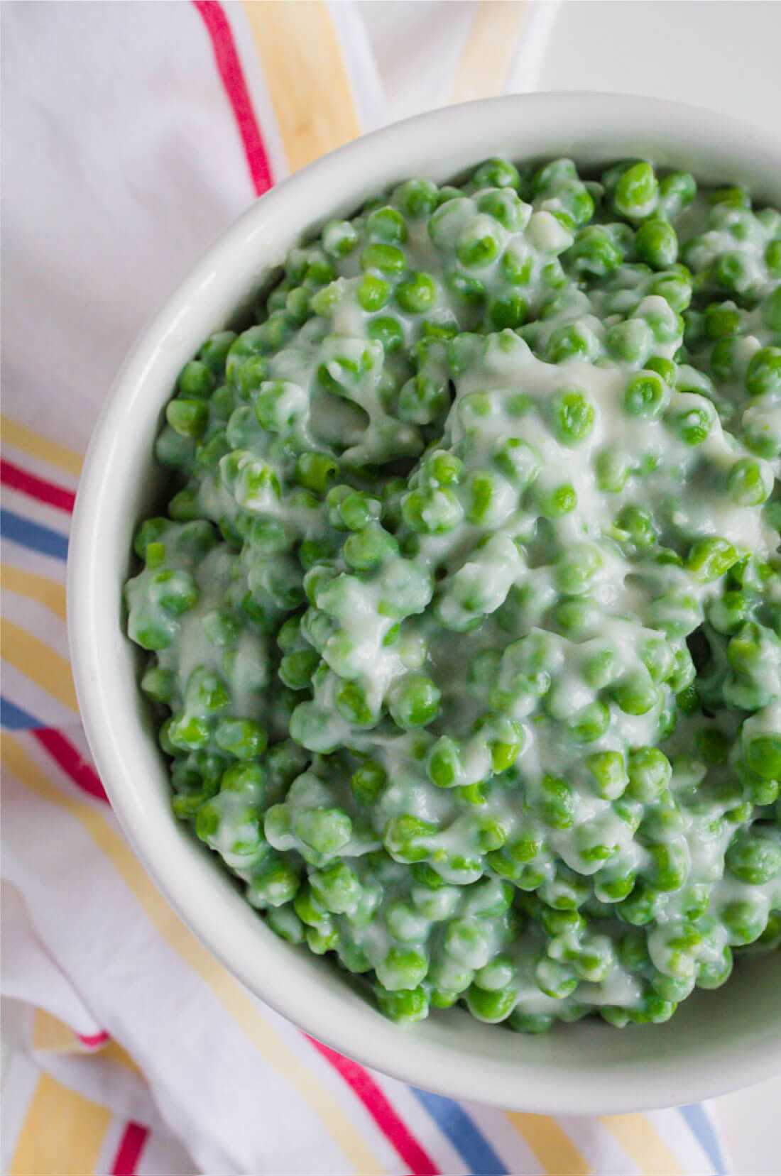A delicious side dish, these Creamed Peas are yummy and easy to make. Up close image. 