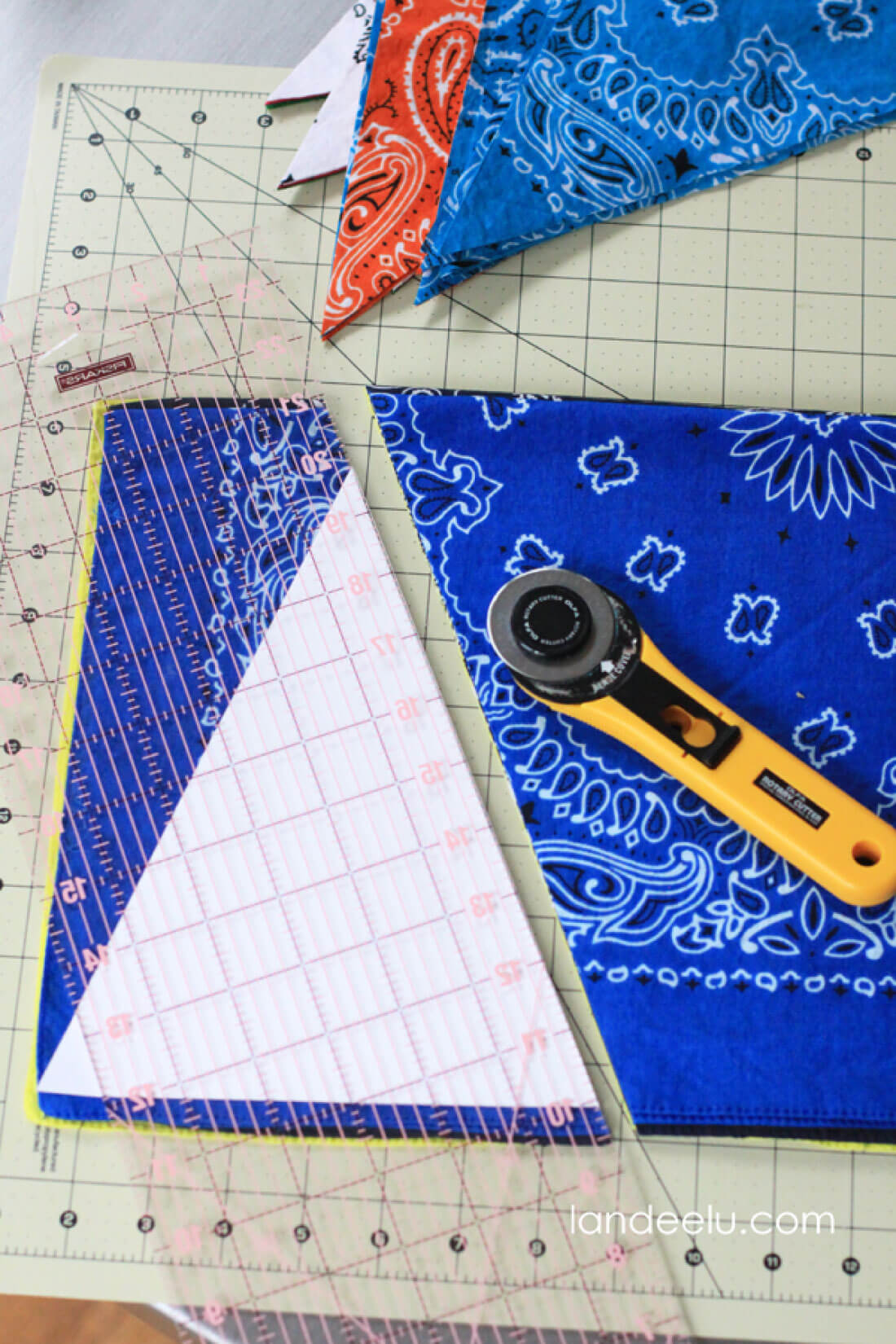 Easy DIY Bandana Party Banner  - cutting out flags.