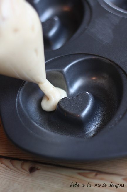 filling doughnut pan