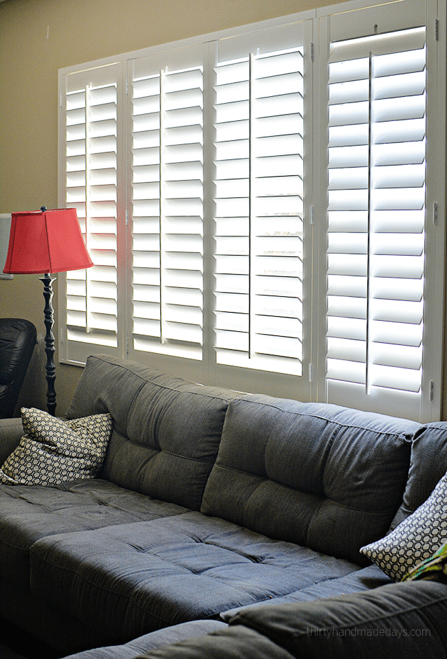 Family room with plantation shutters www.thirtyhandmadedays.com