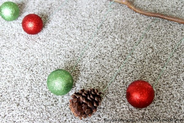 glitter ornaments and pinecones
