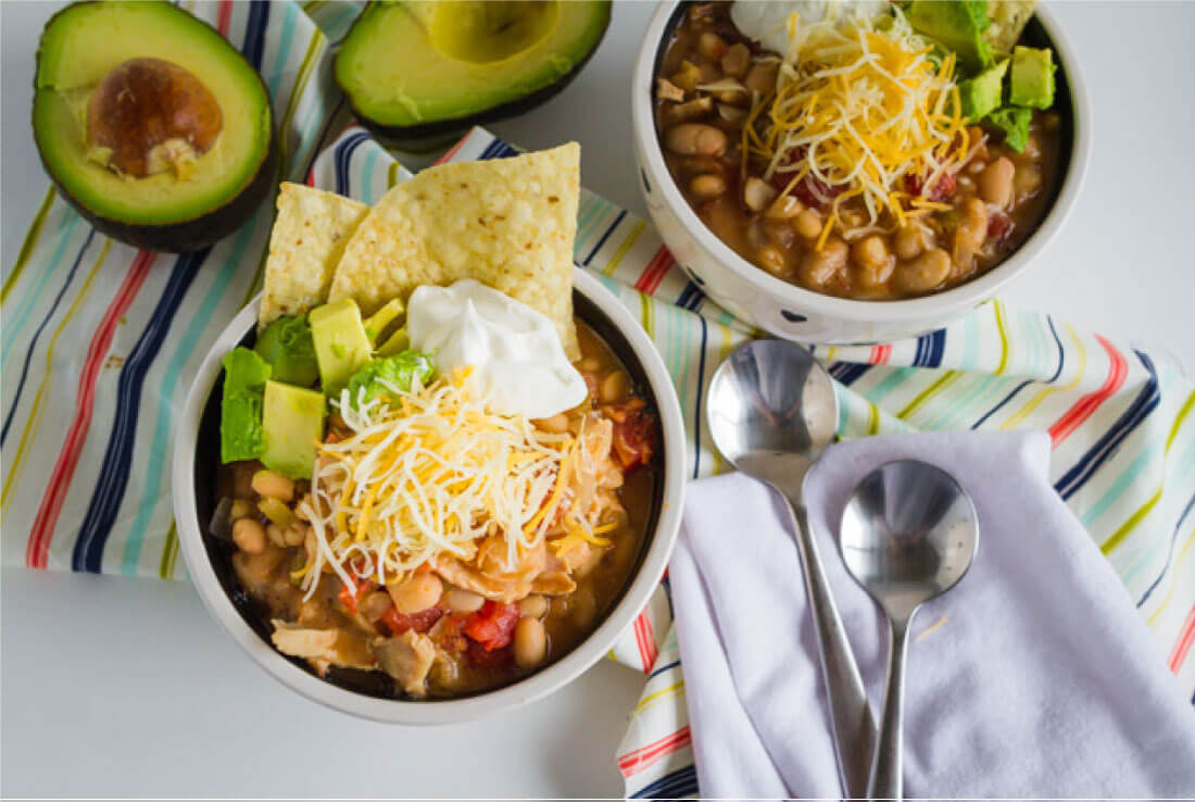 Slow Cooker White Bean Chicken Chili Recipe - a healthy recipe that your whole family will love. Perfect for a cold day!