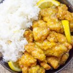 Classic Lemon Chicken with crispy battered chicken thighs in a sweet and tangy sauce. You can skip the delivery and the wait and make it at home!