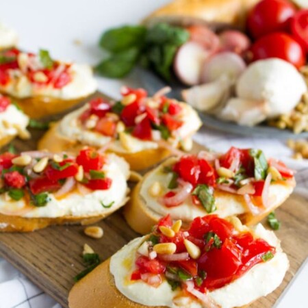 Tomato Crostini with Whipped Feta - this is the best appetizer ever. So delicious! www.thirtyhandmadedays.com