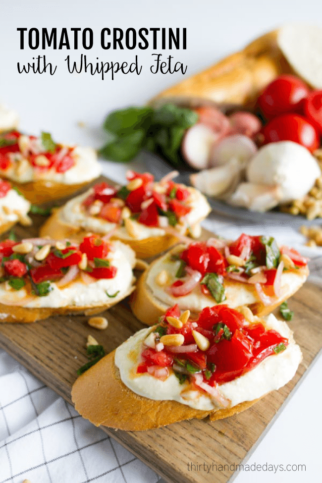 Tomato Crostini with Whipped Feta - this is the best appetizer ever. So delicious! www.thirtyhandmadedays.com