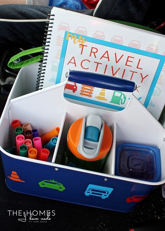Keep the kids entertained on your next car trip with this easy, creative AND functional Car Caddie! Be sure to fill it up with all the treats and toys your kids love!