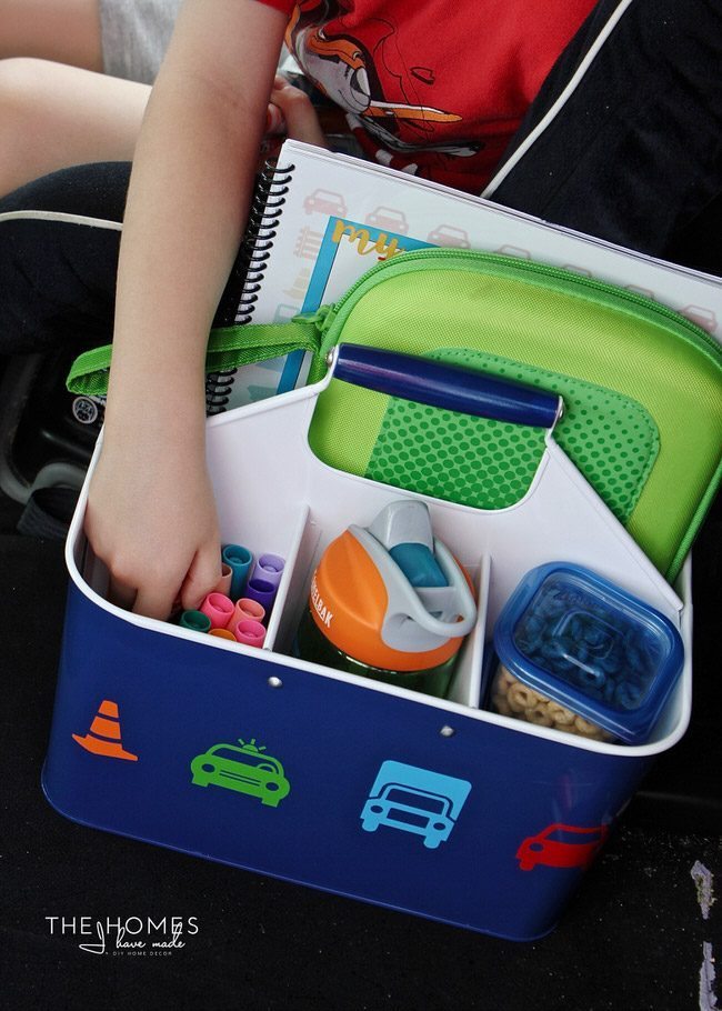 Keep the kids entertained on your next car trip with this easy, creative AND functional Car Caddie! Be sure to fill it up with all the treats and toys your kids love!