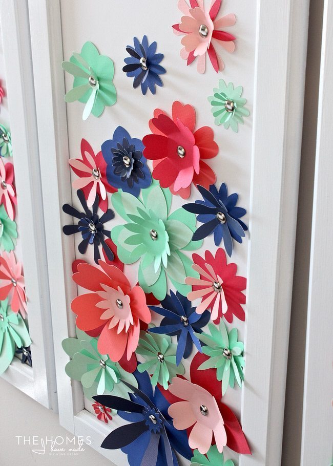 With a stack of colorful cardstock (and a scissors or e-cutter!) you can make inexpensive, easy, and eye-popping flower artwork for anywhere in your home!