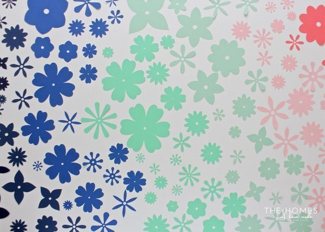 With a stack of colorful cardstock (and a scissors or e-cutter!) you can make inexpensive, easy, and eye-popping flower artwork for anywhere in your home!