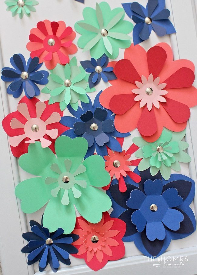 With a stack of colorful cardstock (and a scissors or e-cutter!) you can make inexpensive, easy, and eye-popping flower artwork for anywhere in your home!