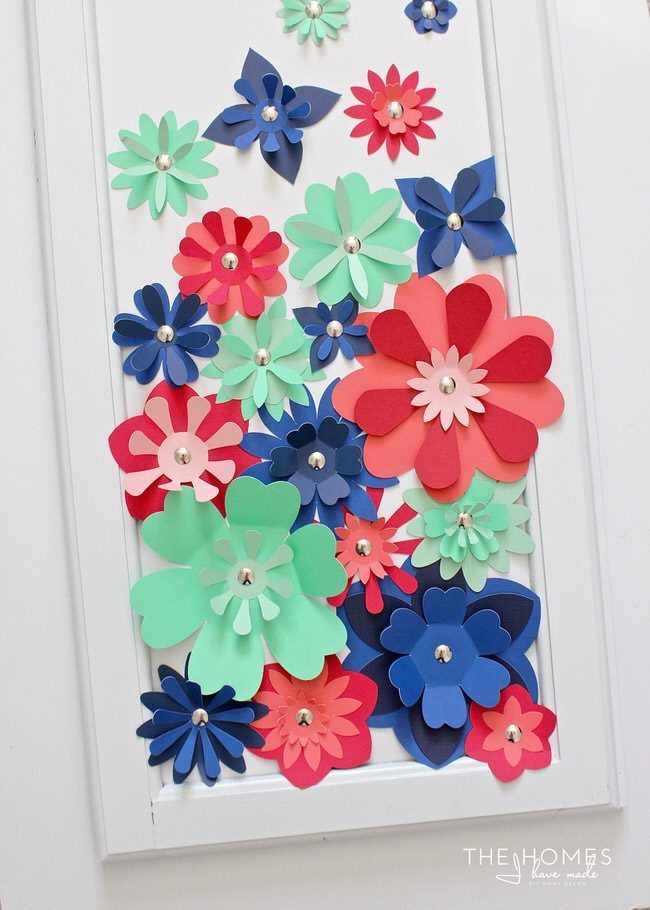 With a stack of colorful cardstock (and a scissors or e-cutter!) you can make inexpensive, easy, and eye-popping flower artwork for anywhere in your home!