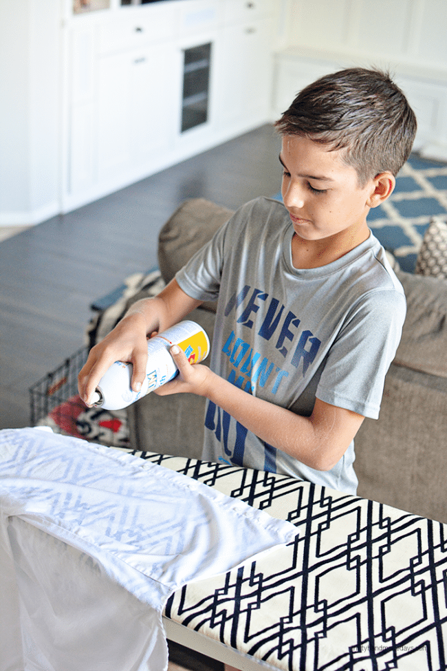 Teaching kids How to Iron - spraying Faultless Starch from www.thirtyhandmadedays.com