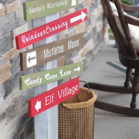Holidays: DIY North Pole Sign- make this adorable sign to sit on your porch for Christmas.