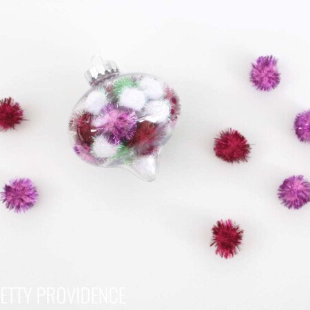 Totally doing this!!! Fun and easy DIY pom pom ornament. I LOVE these and you can use whatever colors of pom poms you want!!