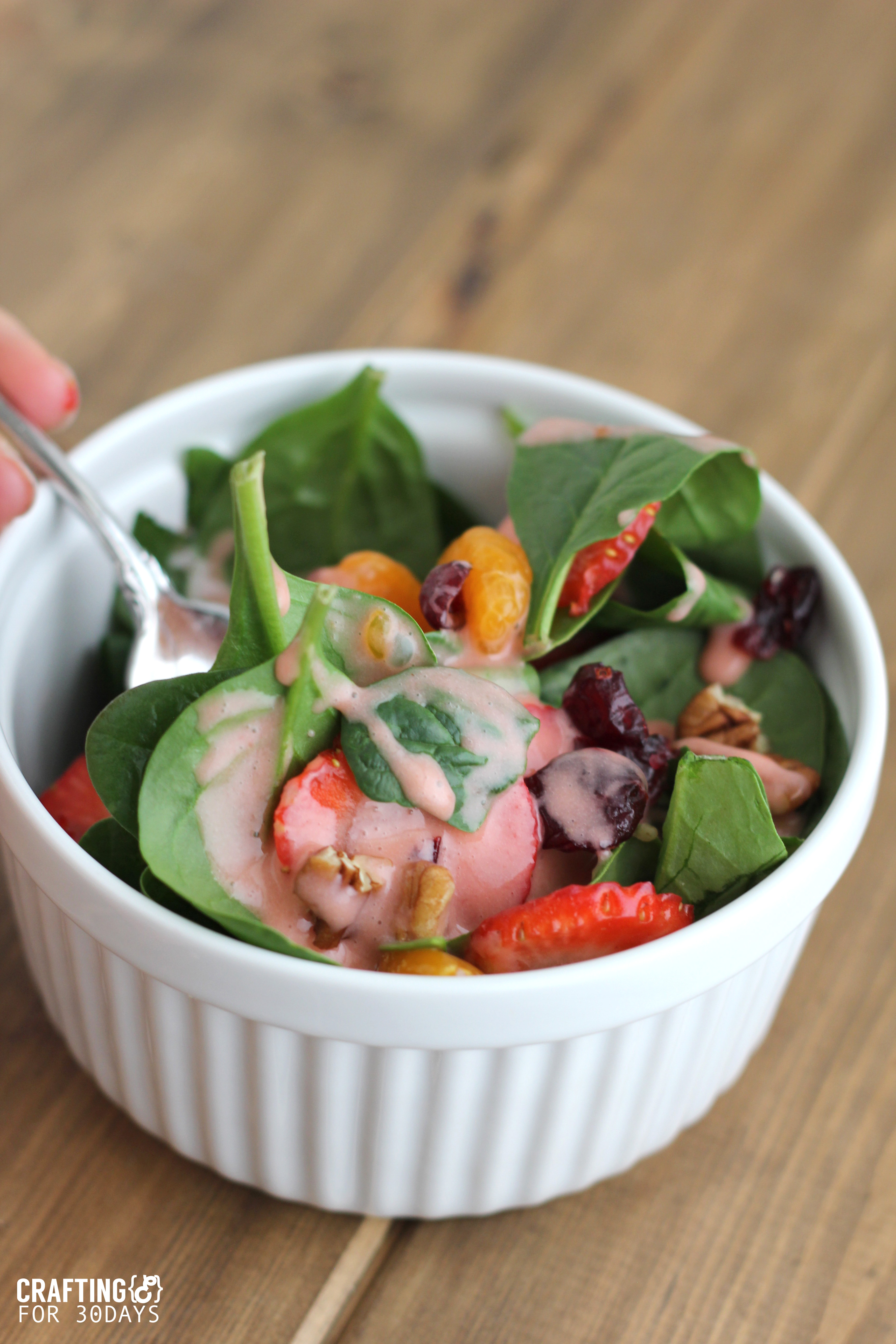 Spinach Strawberry Salad- an awesomely delicious and healthy option for the new year! From CraftingE