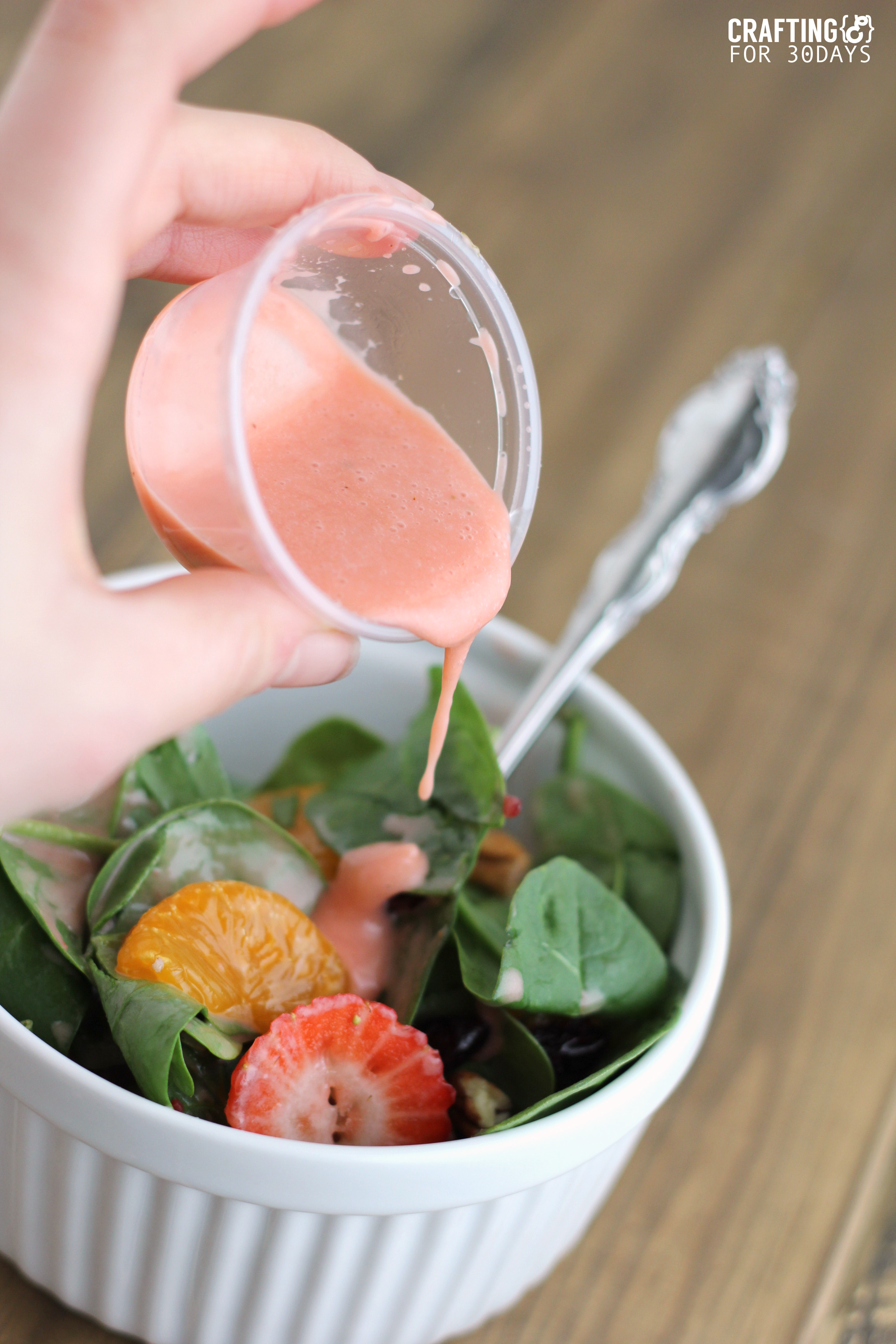 Spinach Strawberry Salad- an awesomely delicious and healthy option for the new year! Yummy salad dressing included.