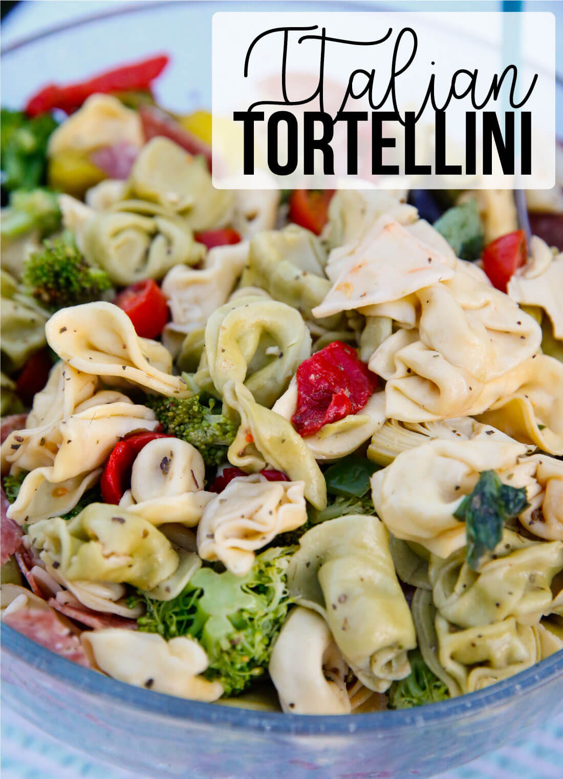 An awesome Italian salad with tortellini, vegetables meats and cheese. This Italian Tortellini Salad will be a huge hit wherever you take it! Perfect potluck dish. www.thirtyhandmadedays.com