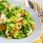 Tortellini Salad - a different take on salad! It has all kind of good ingredients in it. Full bowl of salad.