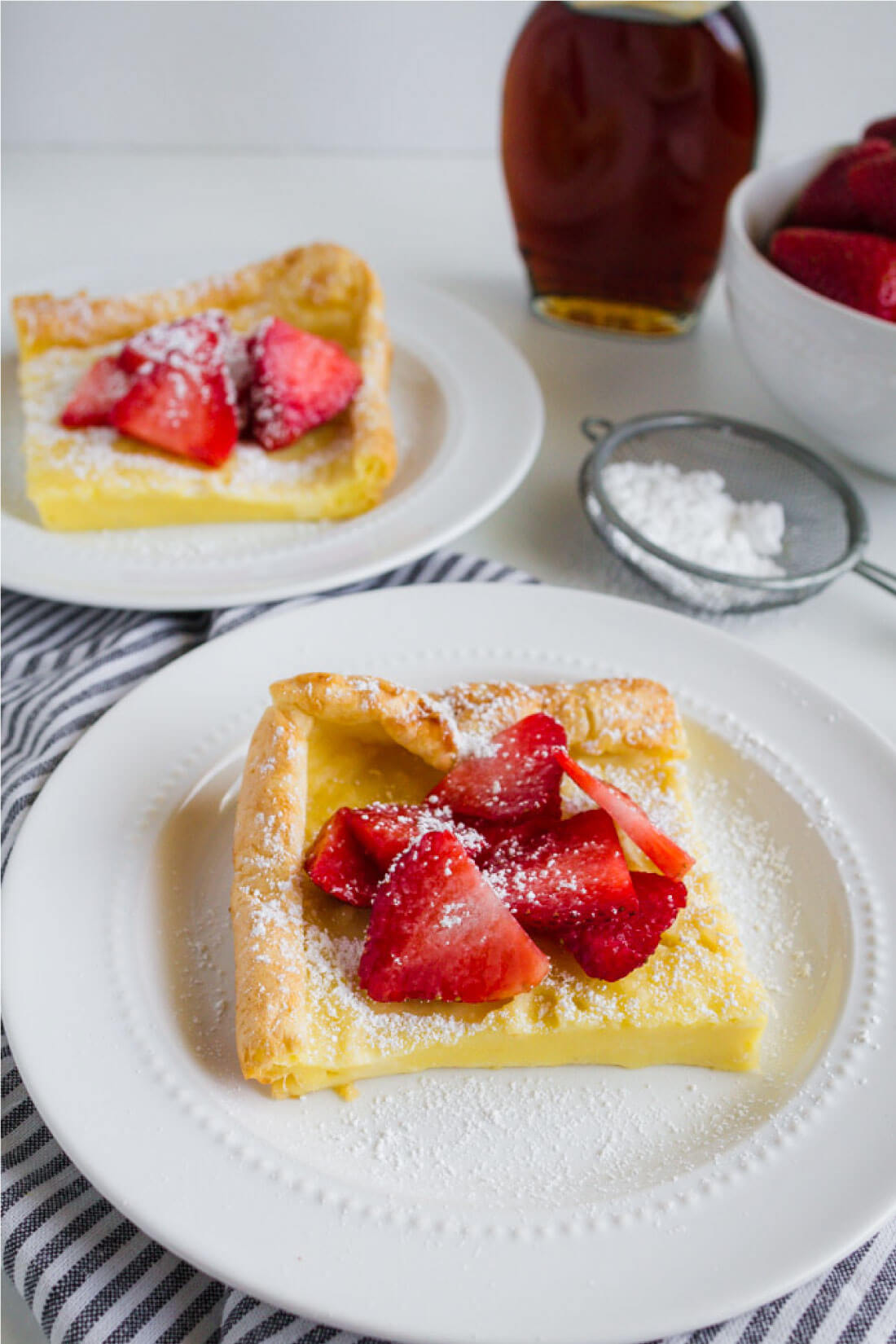 German Pancakes or Dutch Baby recipe - an old family favorite that we love to make for breakfast. Cut up. 