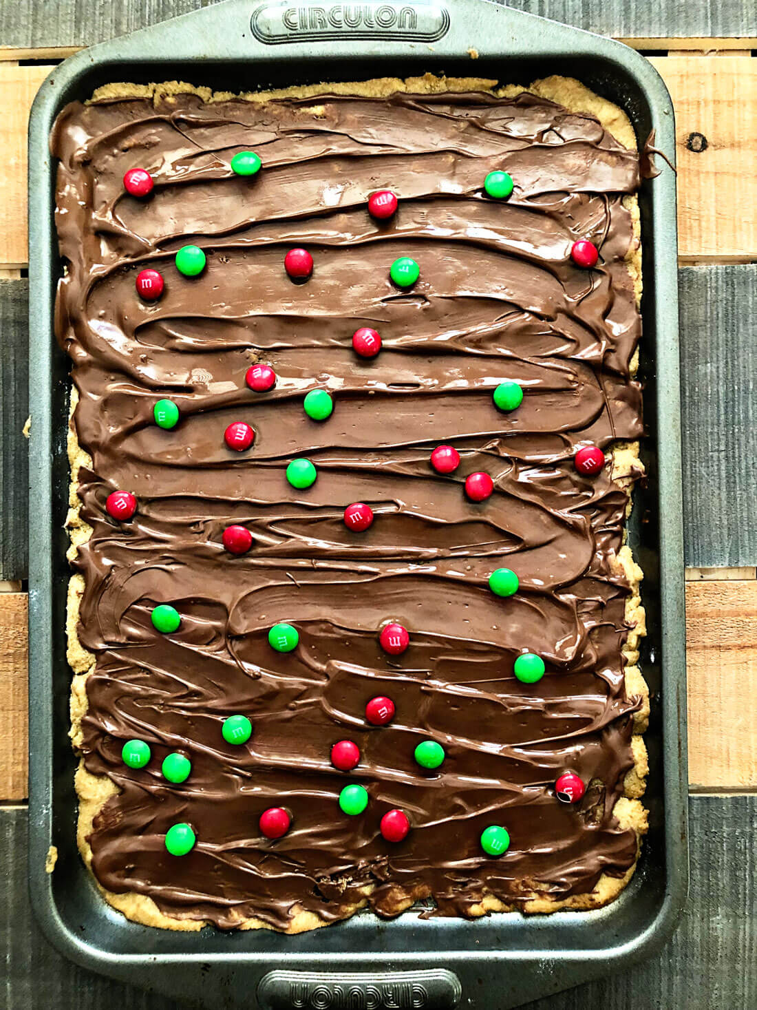 Let cool for a few minutes and add M & M candies on top of the melted chocolate.
