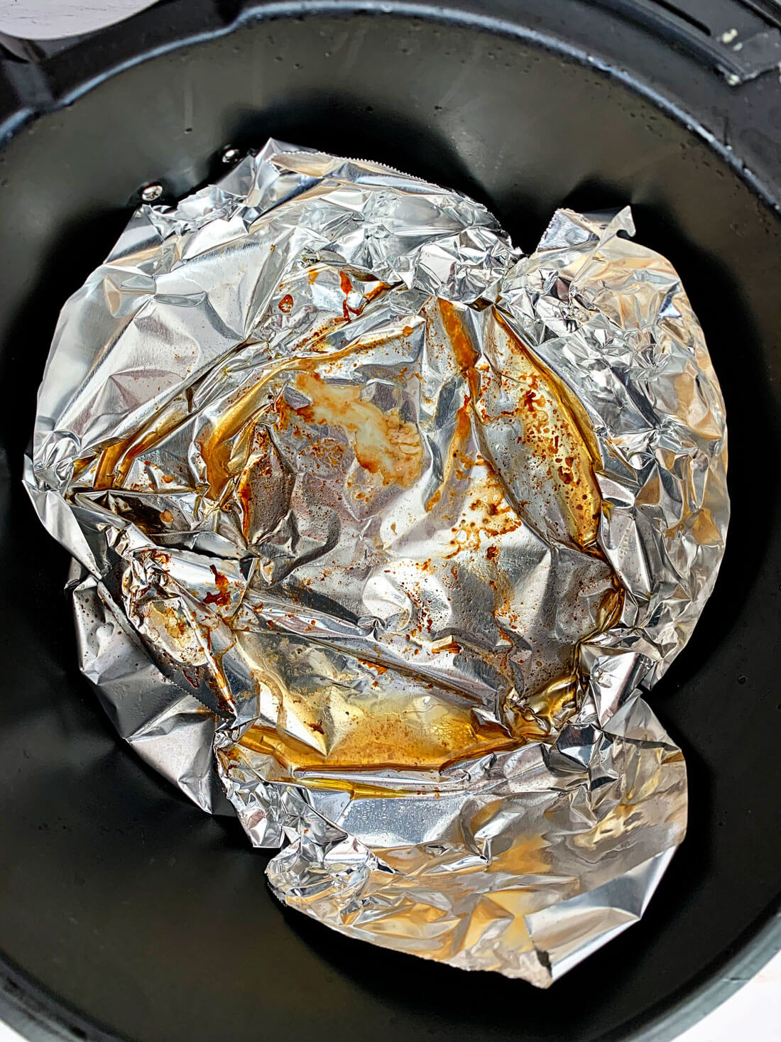 Air fryer juices on tin foil