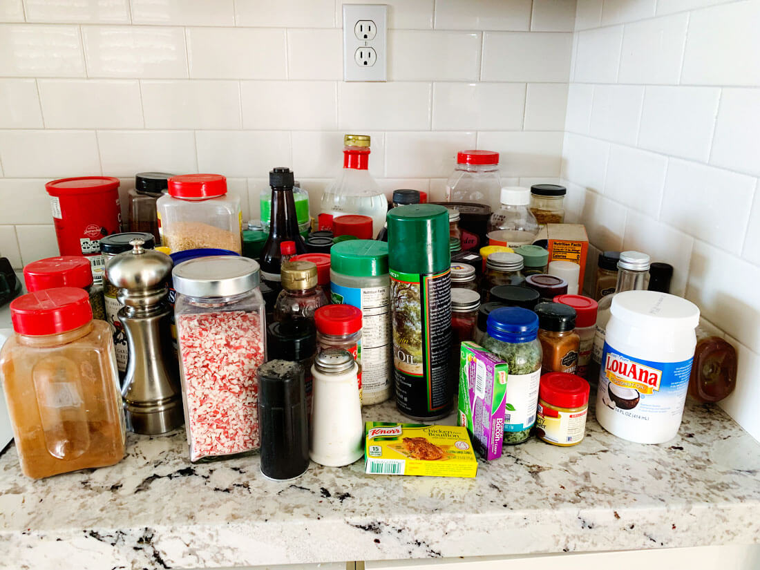 How to organize your spice rack - all of the spices that I pulled out of my cabinets. 