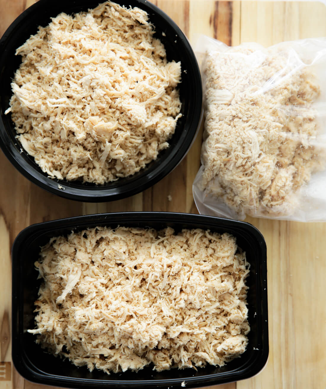 Putting shredded chicken into containers