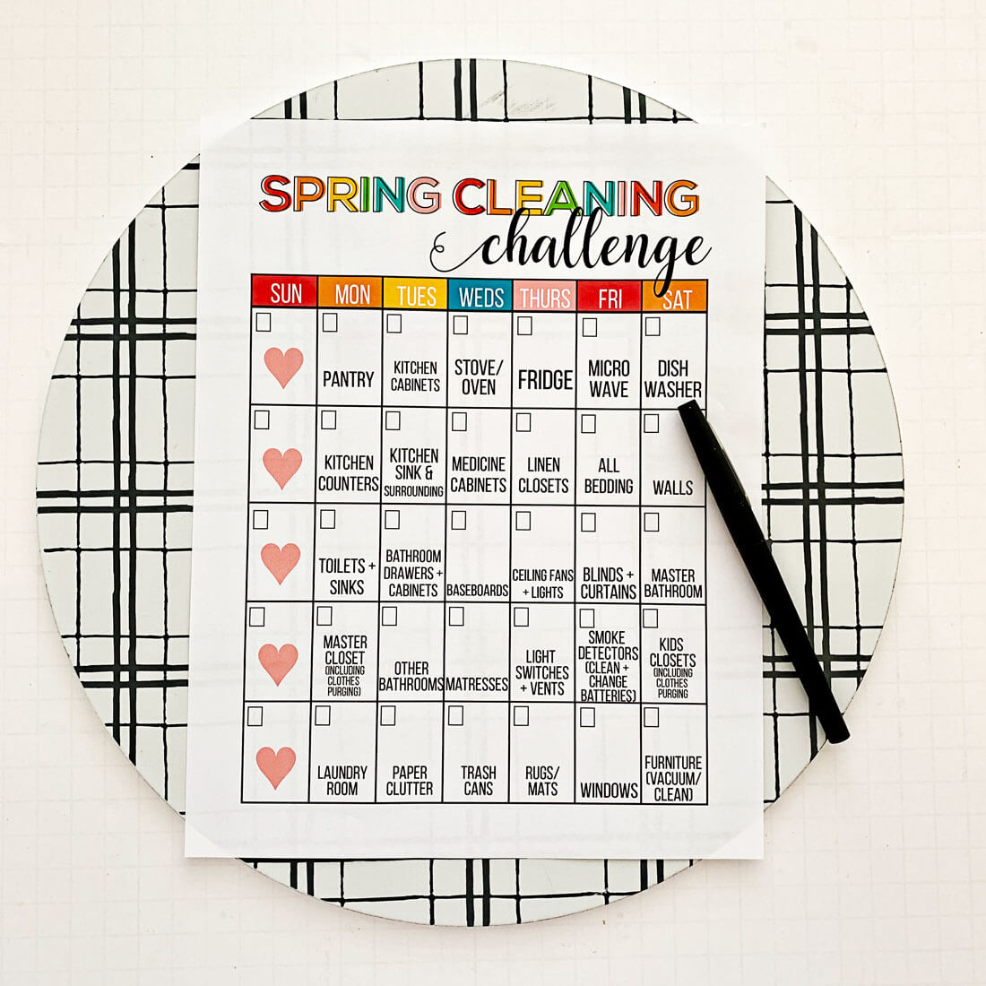 Spring Cleaning Checklist with pen on a clipboard