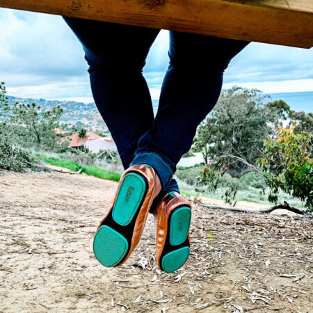 Tieks shoes up close on a swing