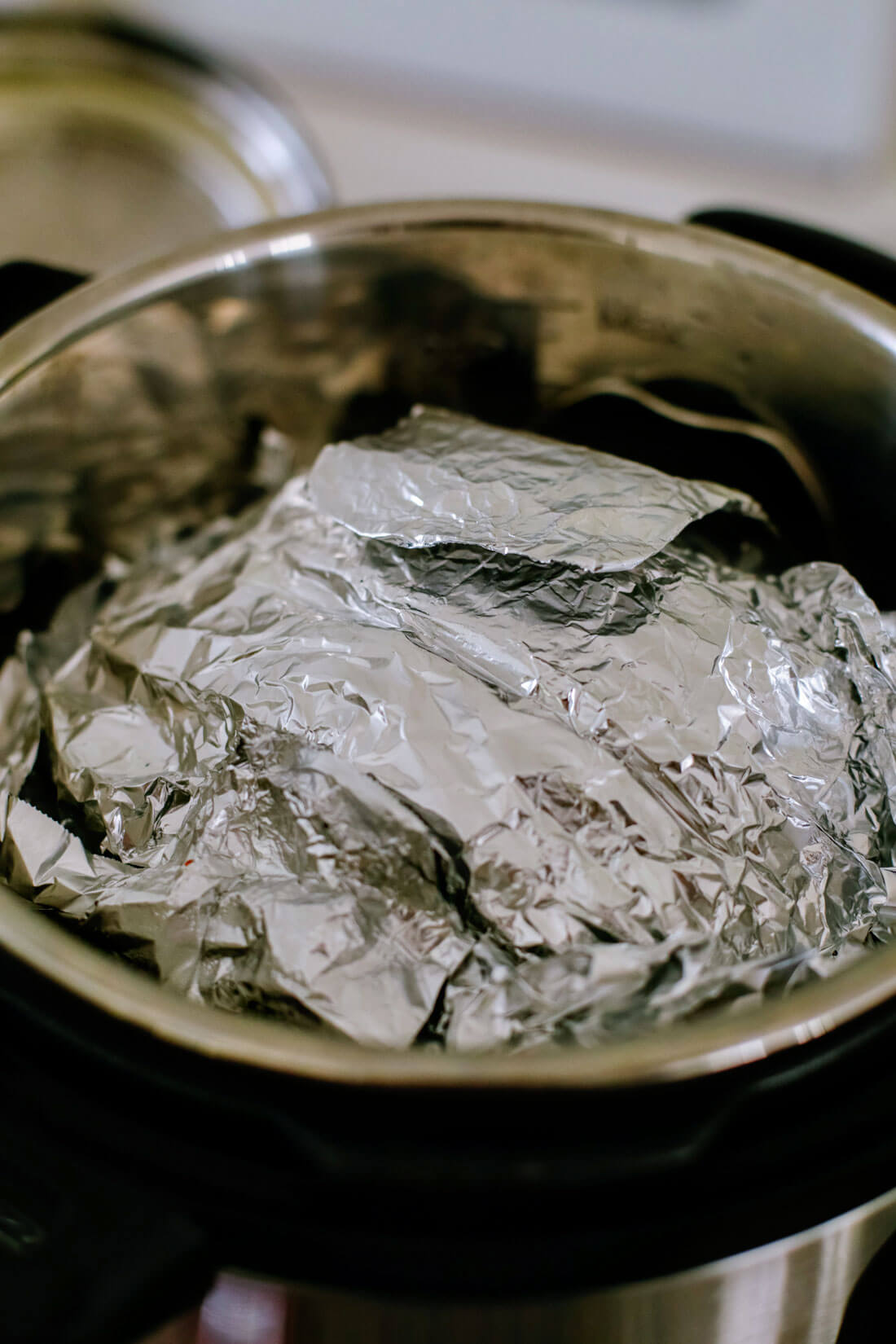 Covering up the ham with aluminum foil